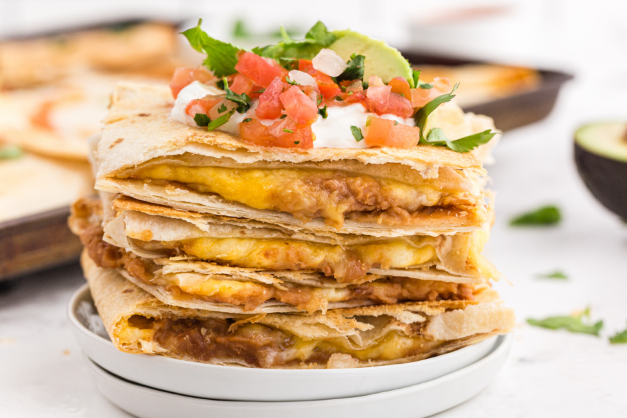 Sheet Pan Quesadillas stacked on a plate