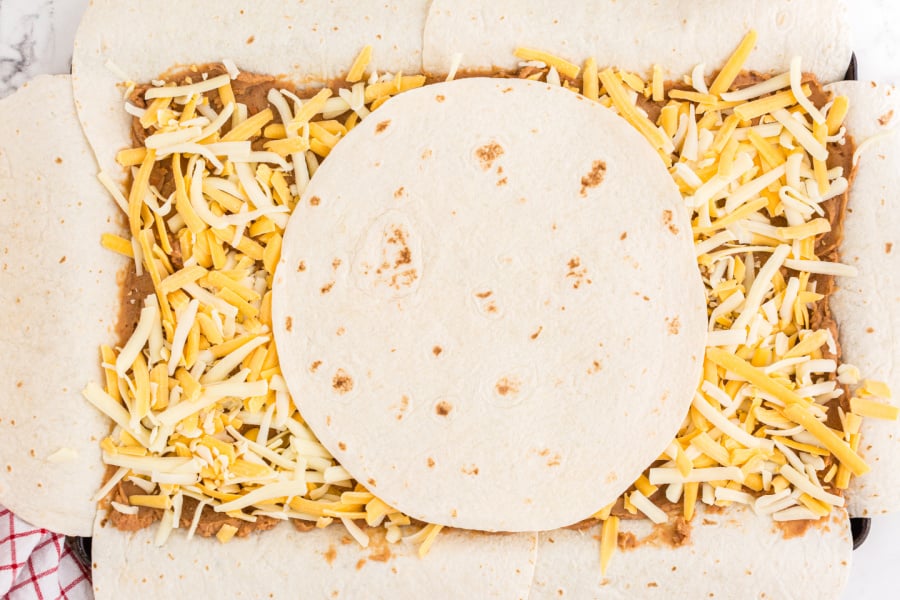 one tortillas placed in center of cheese