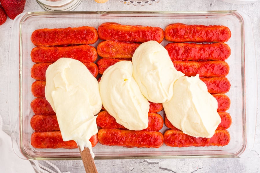 creamy mixture over the strawberry ladyfinger layer.