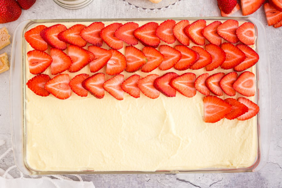 laying strawberry slices over top