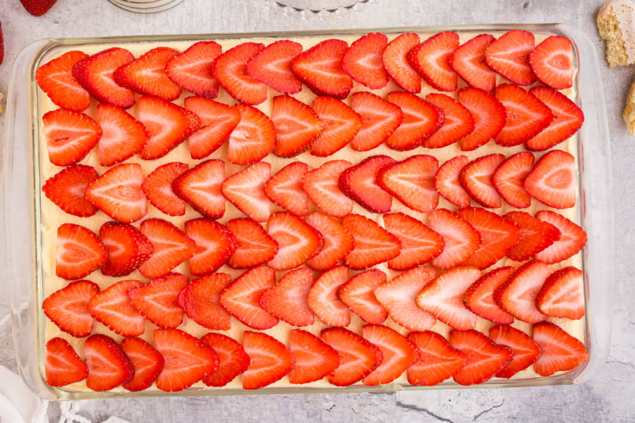 laying strawberry slices over top