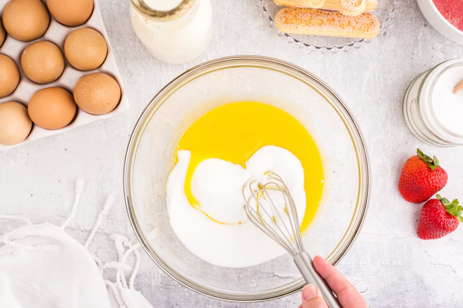 adding sugar to egg mixture