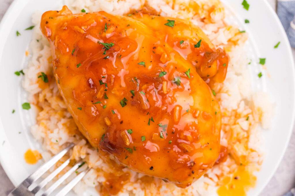 Baked Apricot Chicken on a plate with rice
