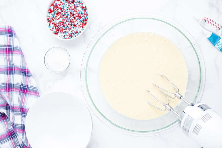 white cake batter in mixing bowl