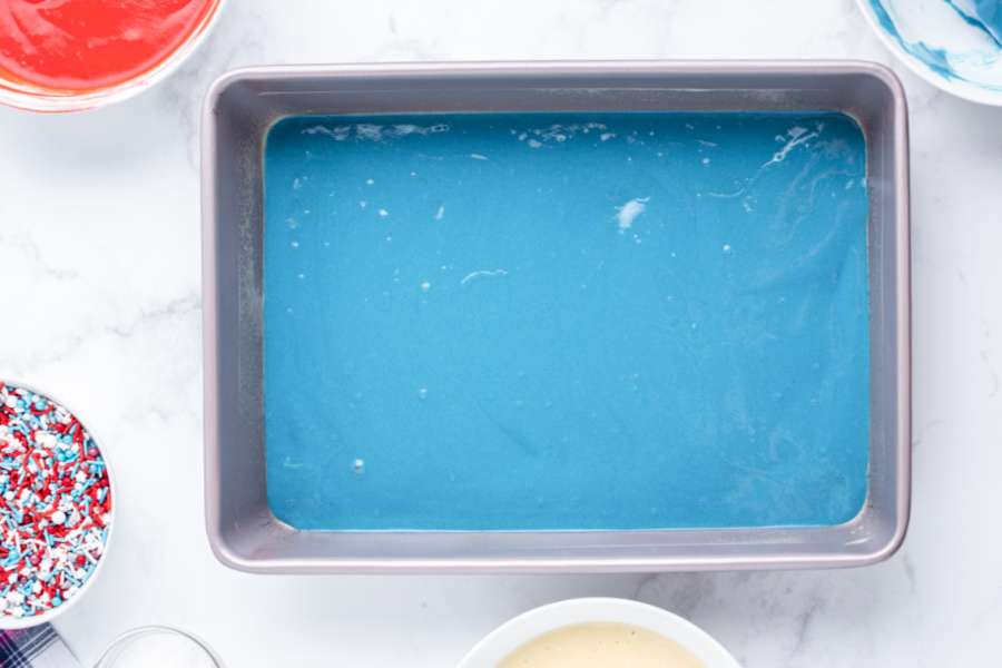 blue cake batter in pan