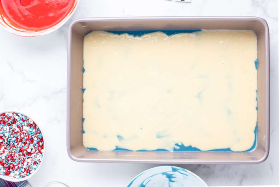 white batter poured over blue batter