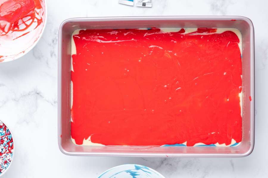 red cake batter added to pan