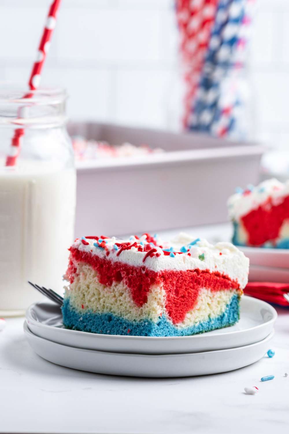 At first look, this cake looks plain, but when you slice in, this Red White and Blue Layered Cake reveals three vivid colors of the flag! via @familyfresh