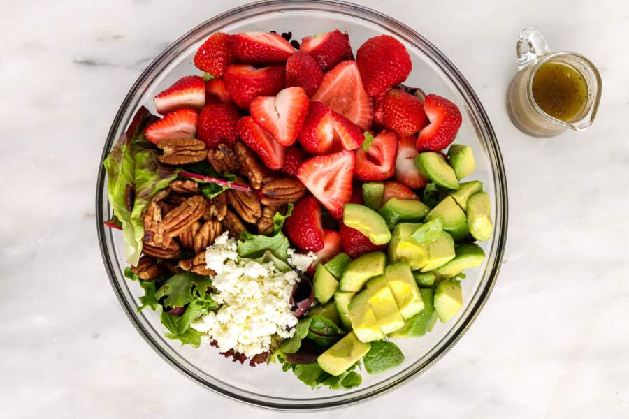 salad ingredients in mixing bowl