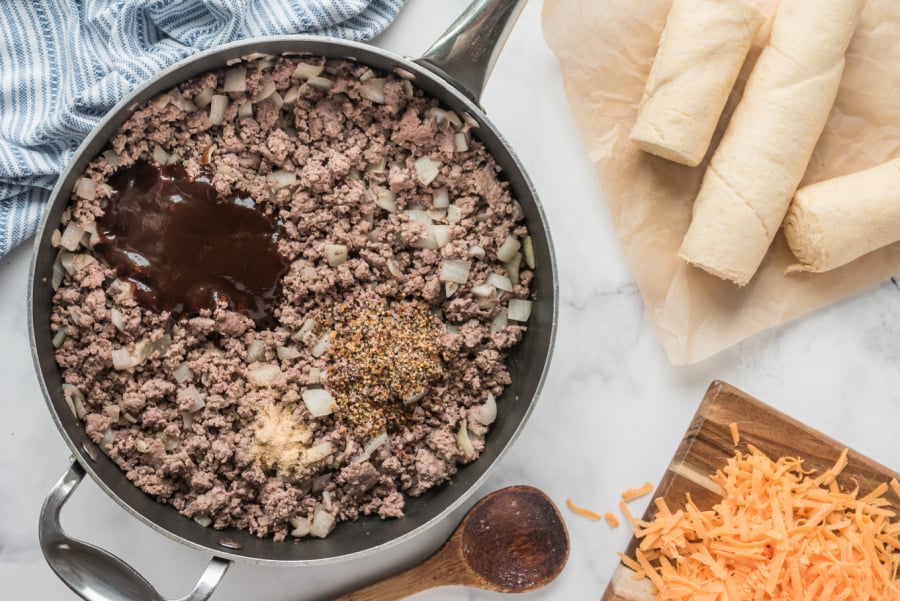 browned beef, onions and seasoning in pan