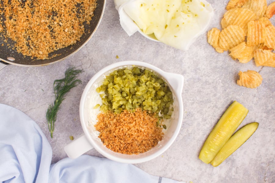 diced pickles and panko crumbs added to bowl