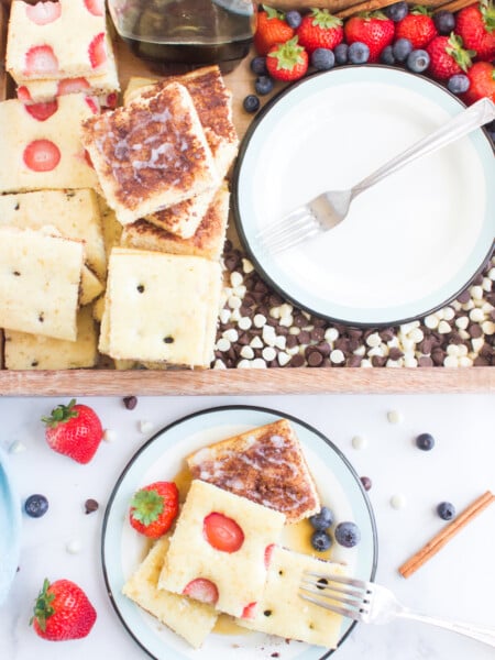 sheet pan pancakes cut up on plater and plate