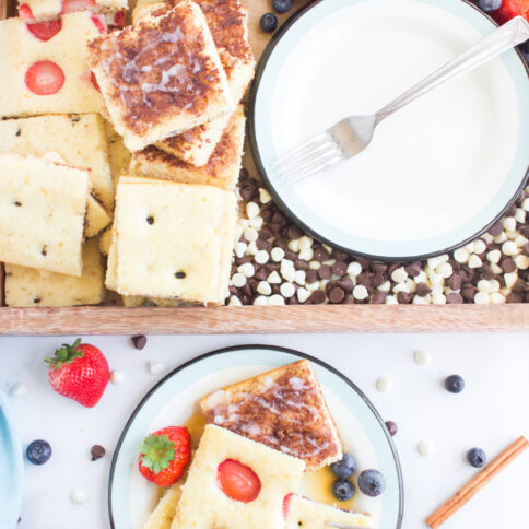 sheet pan pancakes cut up on plater and plate