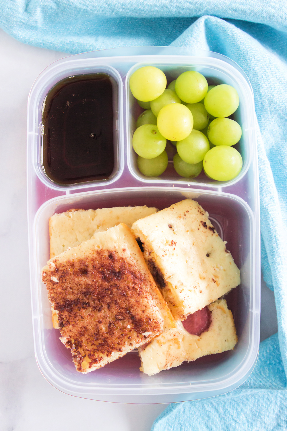 sheet pan pancakes packed in a lunchbox