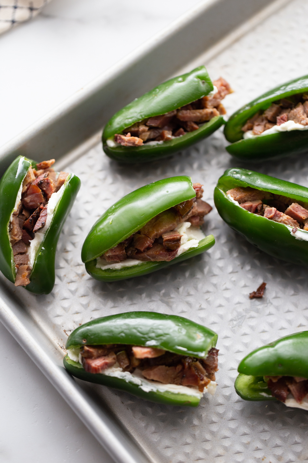 chopped brisket placed inside of jalapenos