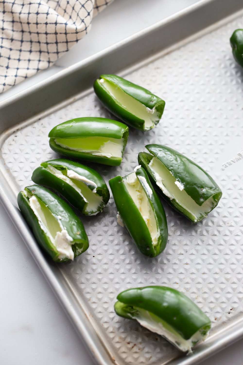 cream cheese placed inside of jalapenos.