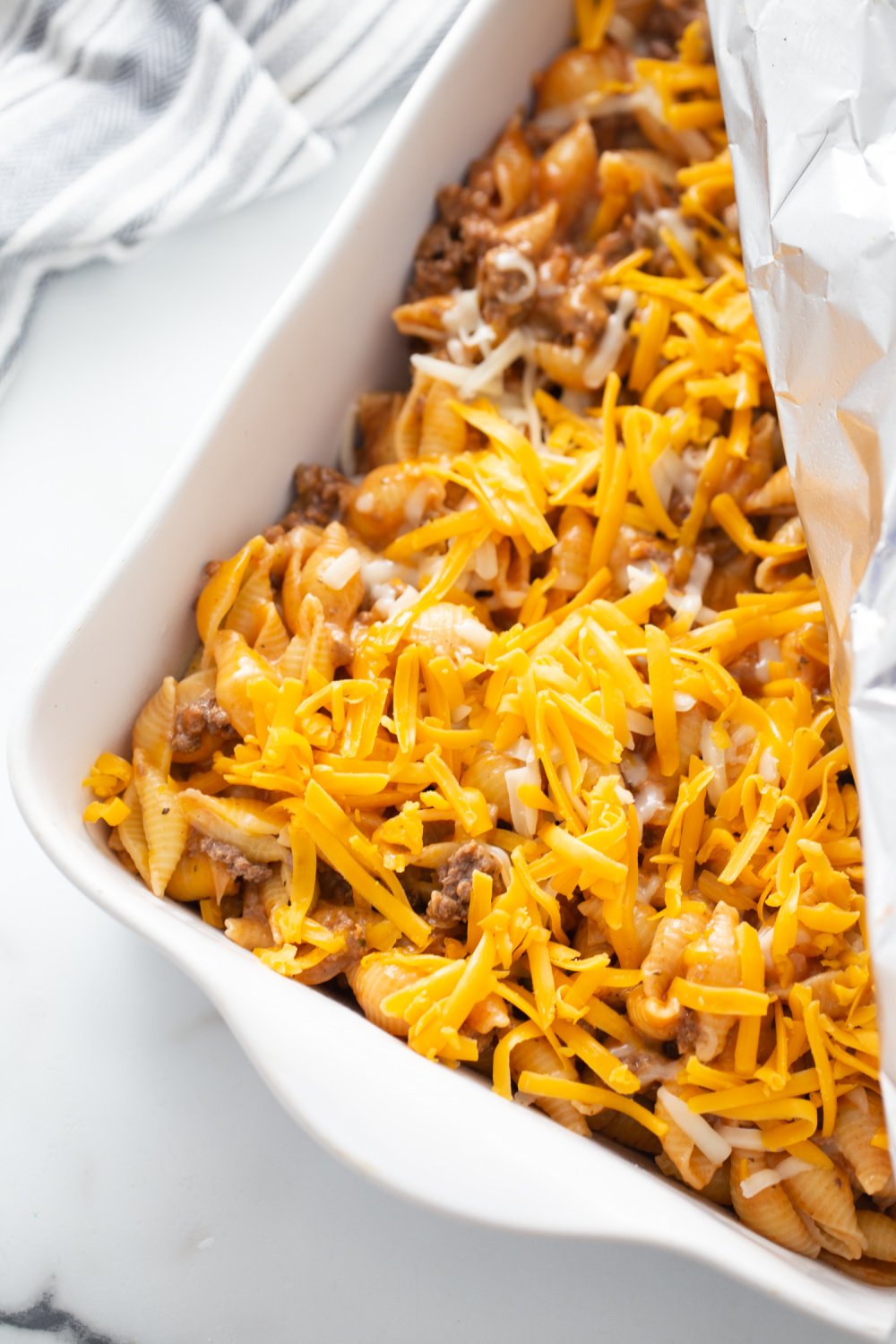 Cheesy Whinge and Shells  placed in casserole dish