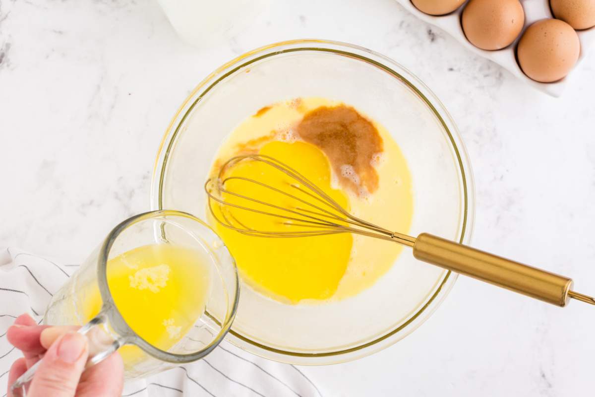 eggs, buttermilk, and vinegar/lemon juice and butter being added to a bowl