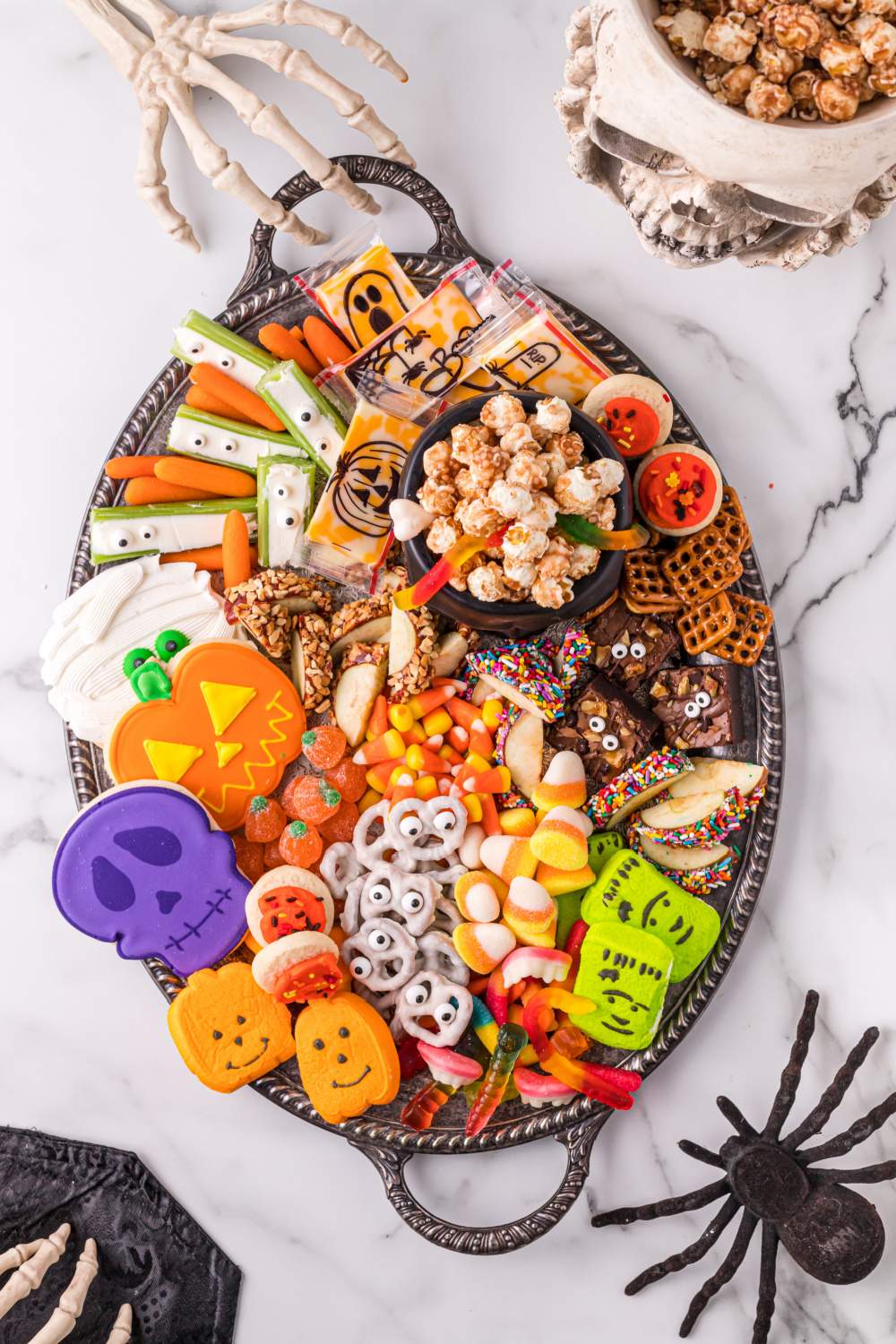 This Fun Kid Halloween Snack Board is so fun and easy to create, literally the kids could put this together for their friends. via @familyfresh