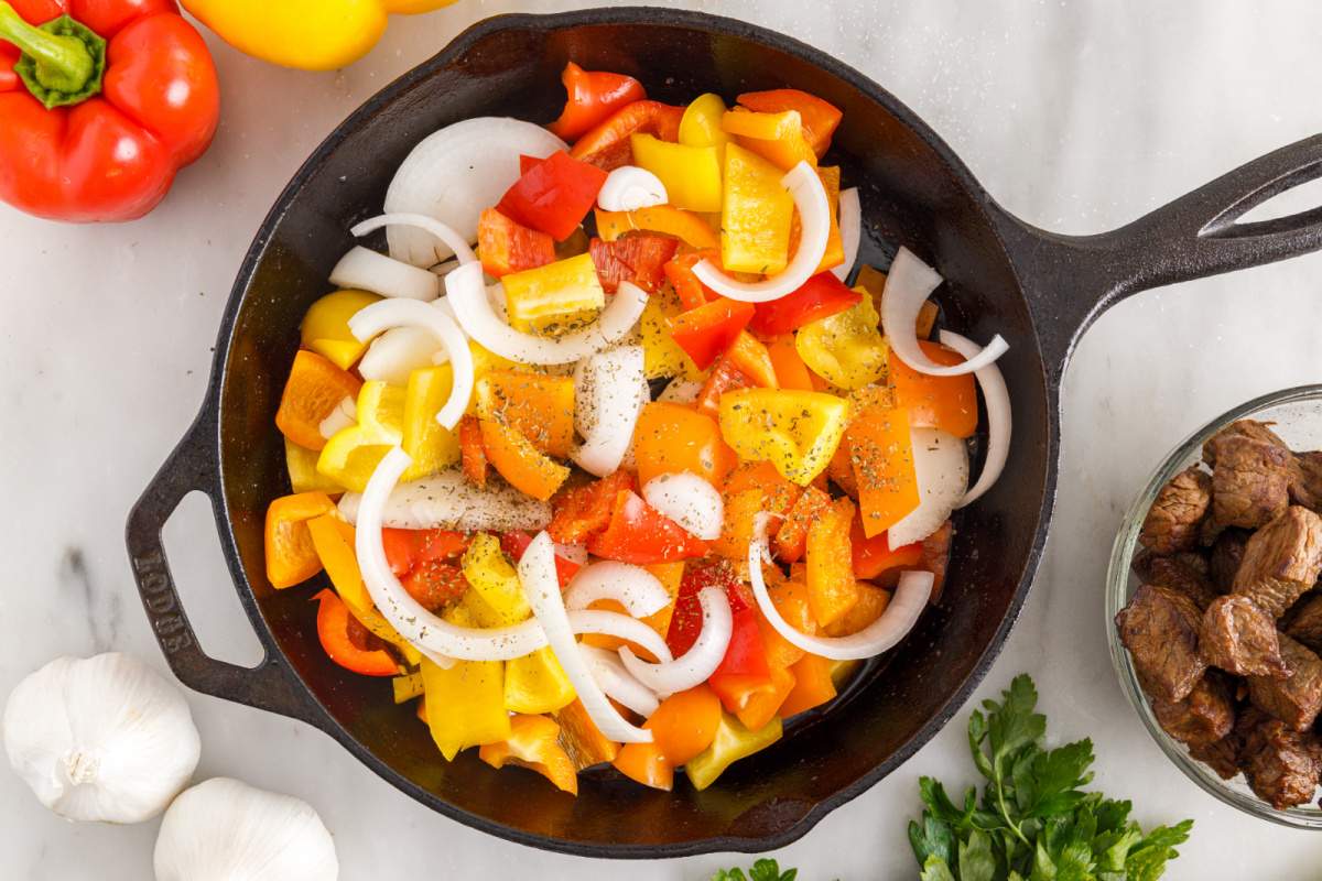 onions and peppers to the pan