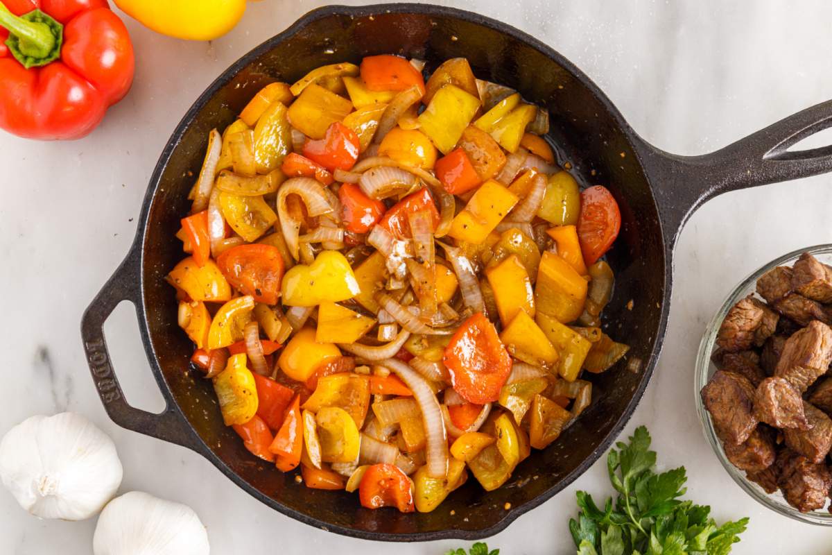 onions and peppers  in pan