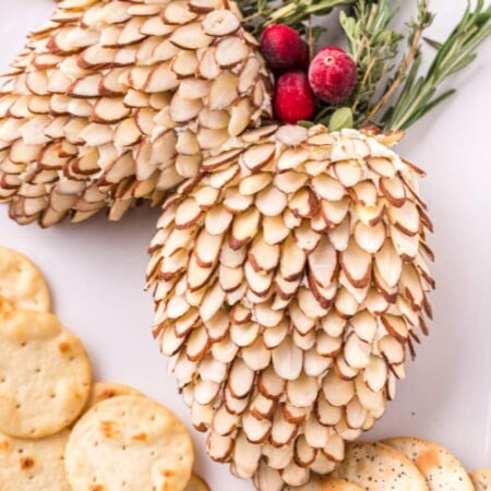 Pinecone Holiday Cheeseballs on a plate with crackers