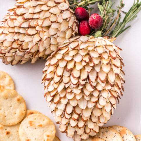 Pinecone Holiday Cheeseballs on a plate with crackers