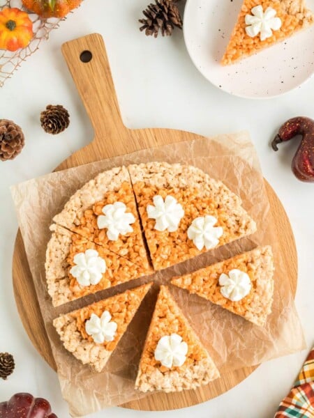 Pumpkin Pie Rice Krispies Treats on a cutting board