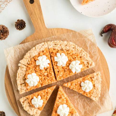 Pumpkin Pie Rice Krispies Treats on a cutting board