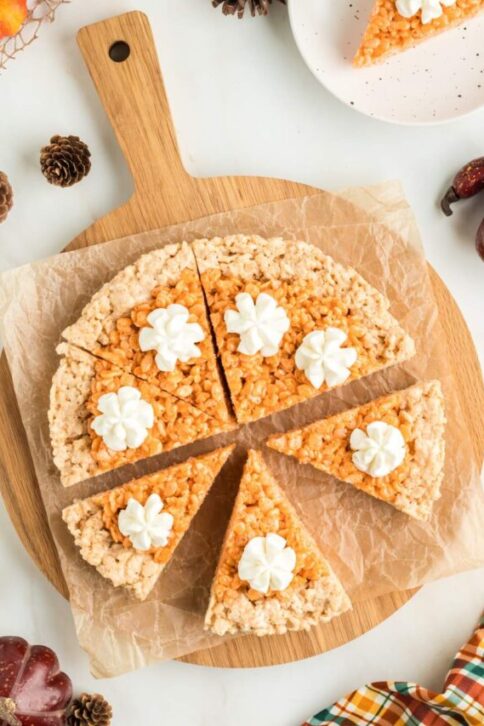 Pumpkin Pie Rice Krispies Treats on a cutting board