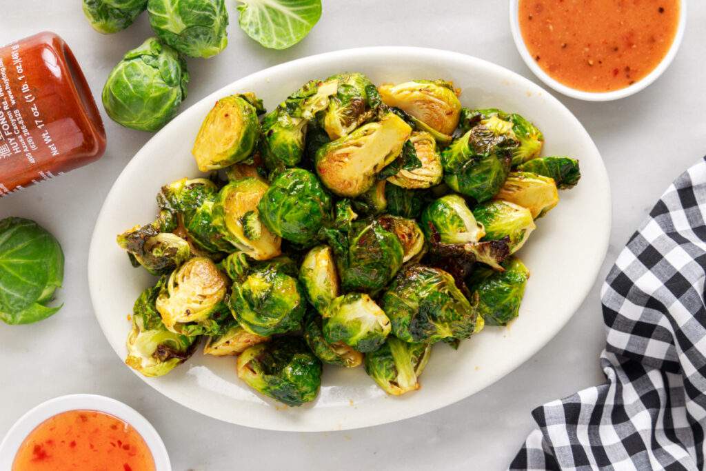 Air Fryer Bang Bang Brussels Sprouts in a serving bowl