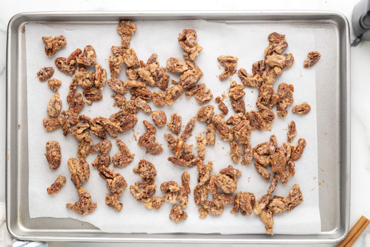 candied pecans on baking sheet