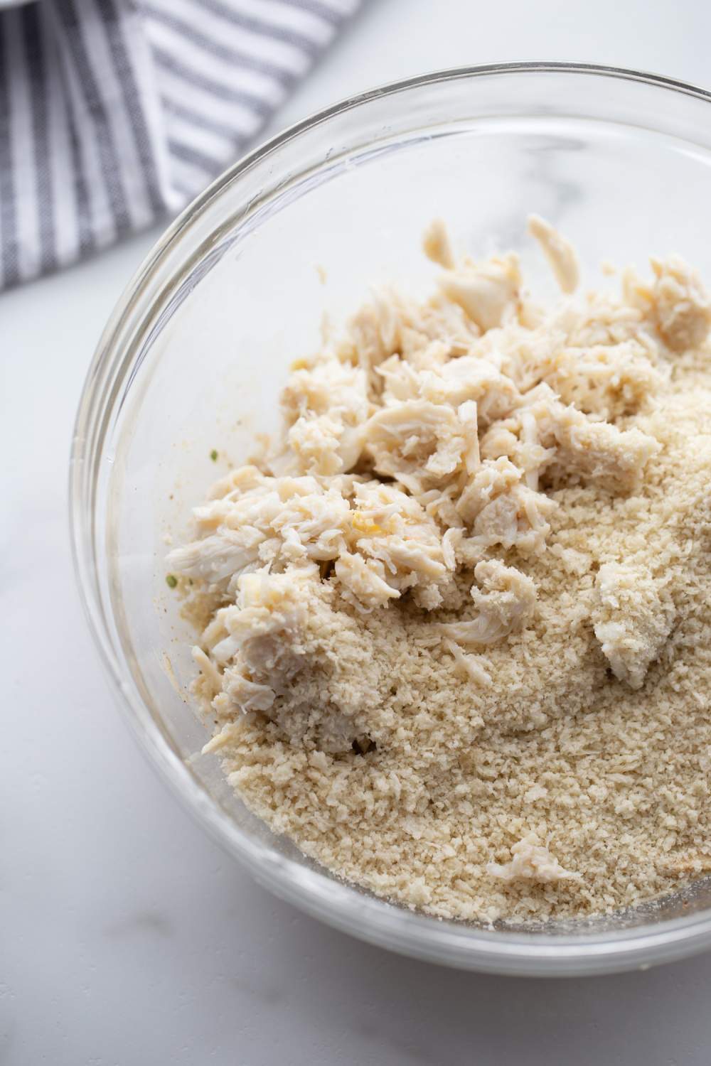 crab meat and bread crumbs added to mixing bowl