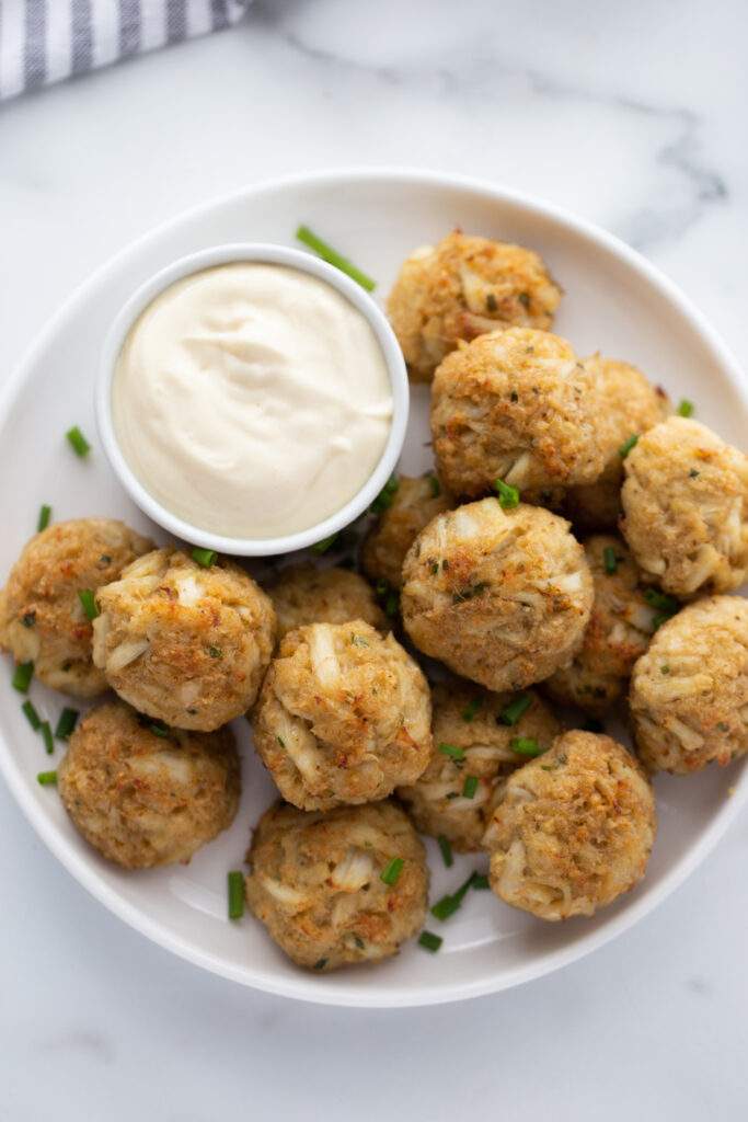 Crab Cake Balls on a plate with creamy dip