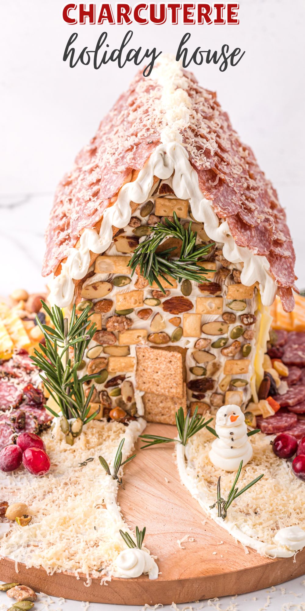 You know those gingerbread houses decorated with sweets? Well, this Charcuterie Holiday House Chalet is a savory version – covered with meats! via @familyfresh