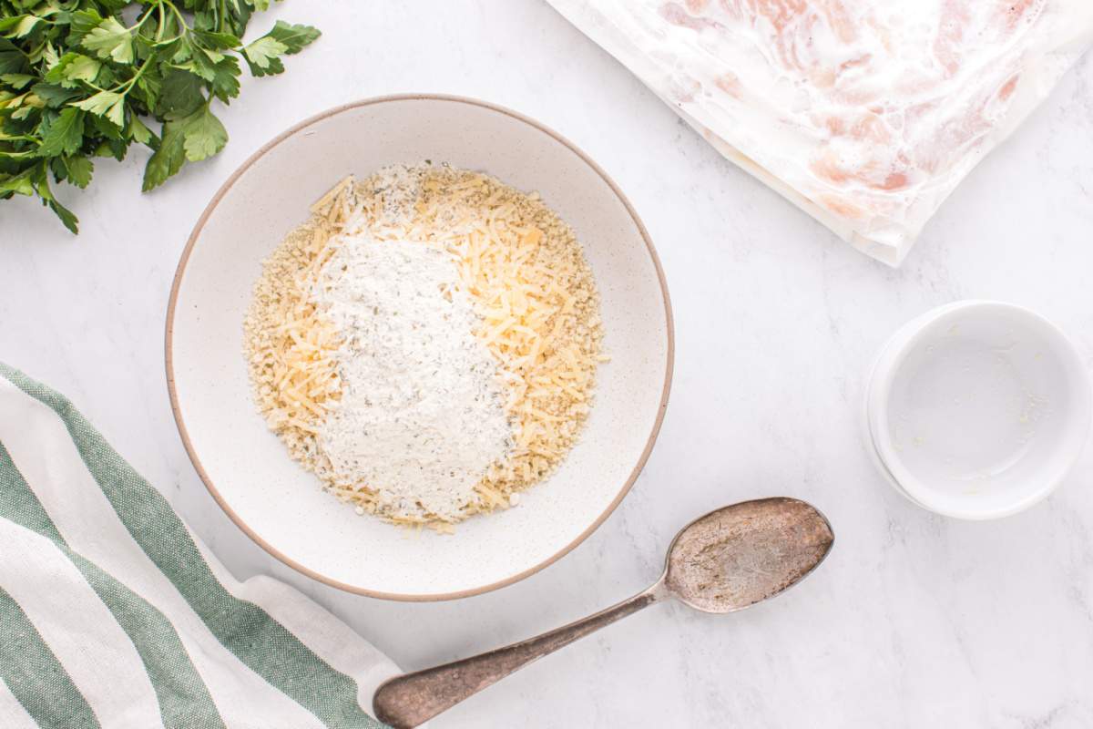 mixing together panko and seasonings in bowl