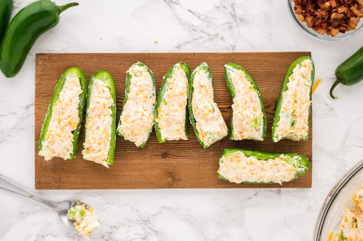 filling jalapenos with creamy mixture