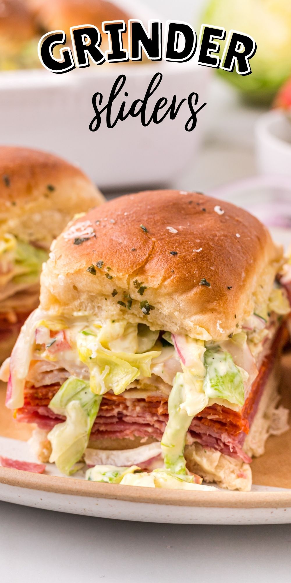 These Grinder Sliders area fresh hot sandwich topped with a delicious slaw mixture and fresh tomatoes that will be the a hit for any crowd. via @familyfresh