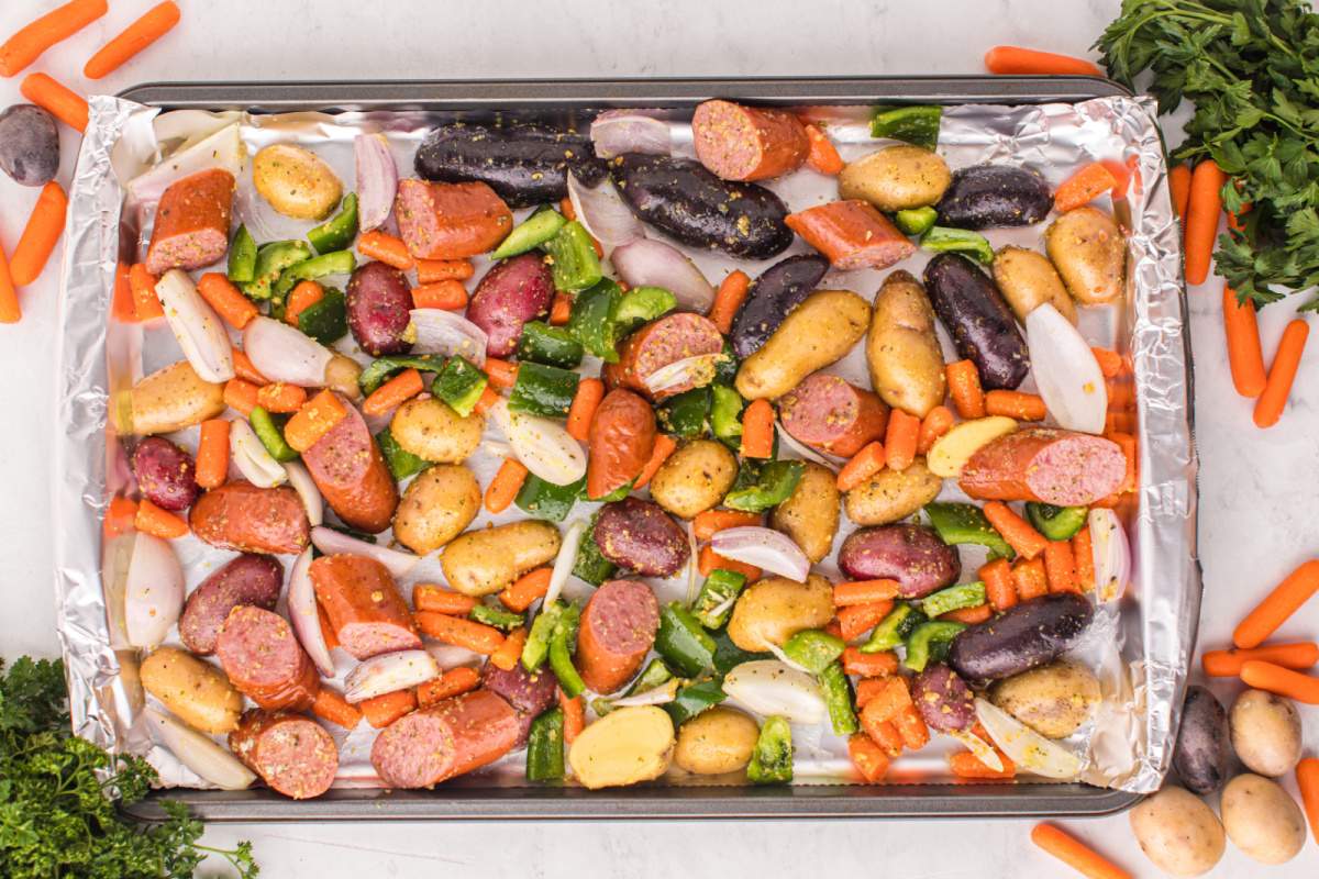 veggies ans sausage on baking sheet