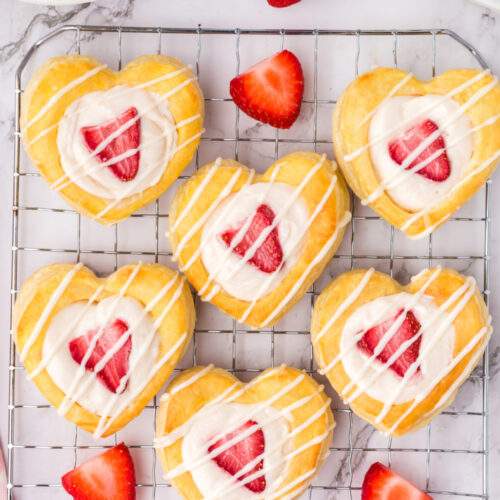 Strawberry Cream Cheese Heart Pastries on a drying rack