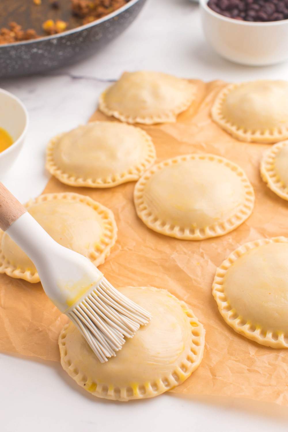 brushing tops of hand pies