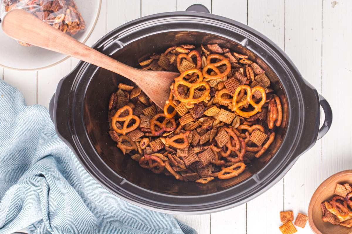 stirring chex mix in slow cooker