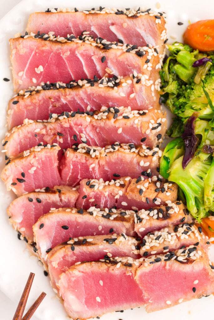 grilled ahi tuna steaks sliced on a plate