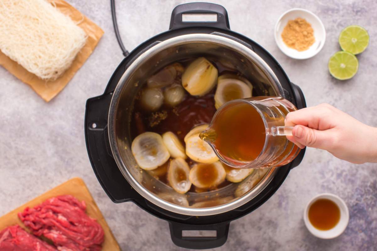 pouring broth into instant pot