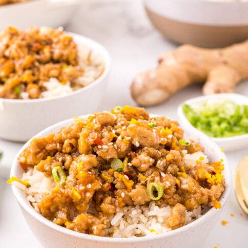 Orange Ground Chicken in bowl with rice