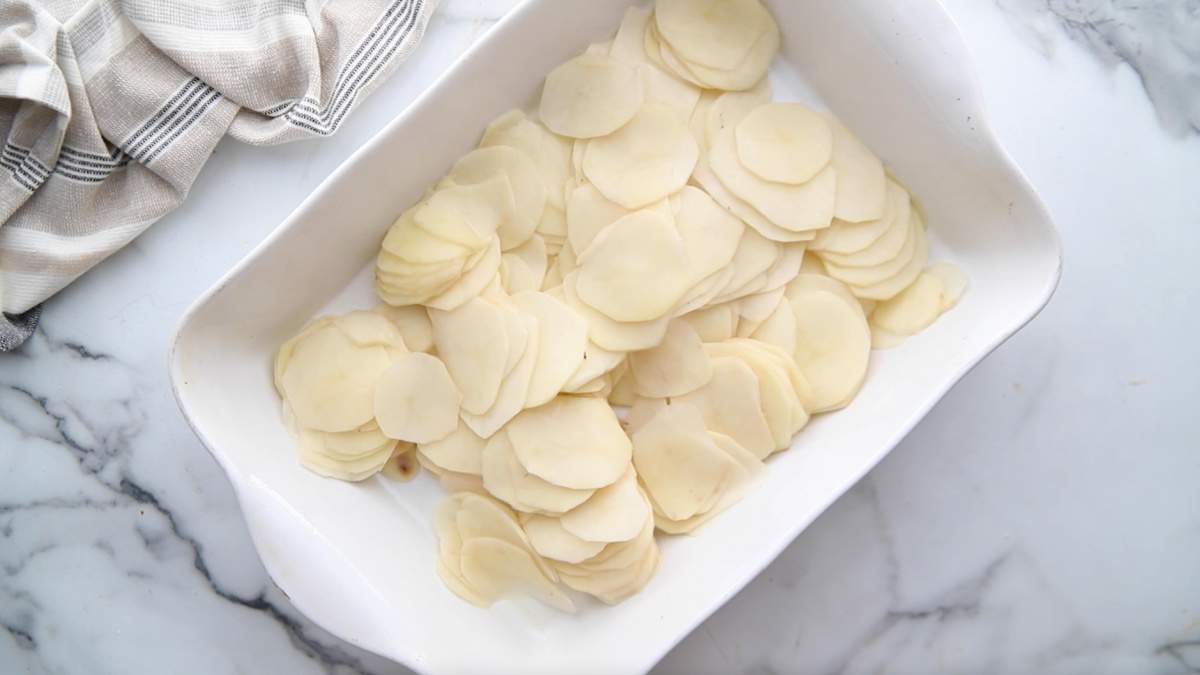 sliced potatoes in baking dish