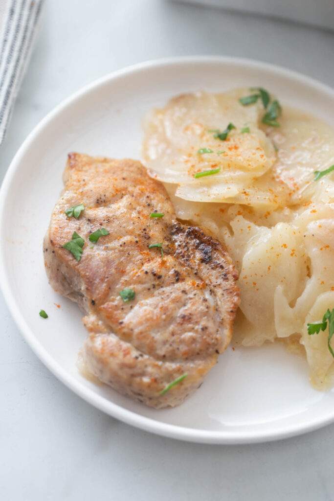 Pork Chops and Scalloped Potatoes Casserole on a plate