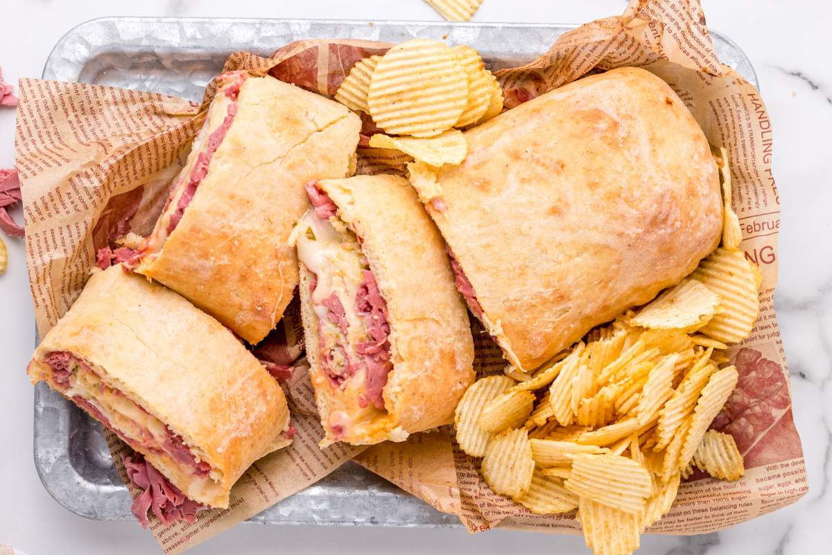 Reuben Garbage Bread on a plater with chips