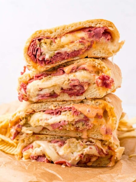 Reuben Garbage Bread pieces stacked on cutting board