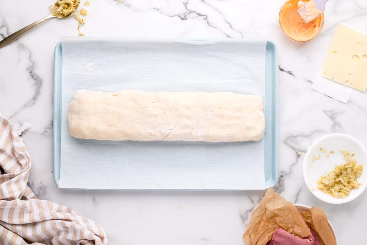 dough rolled on baking dish